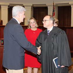 Judge Cory T. Wilson shaking hands with Governor Bryant